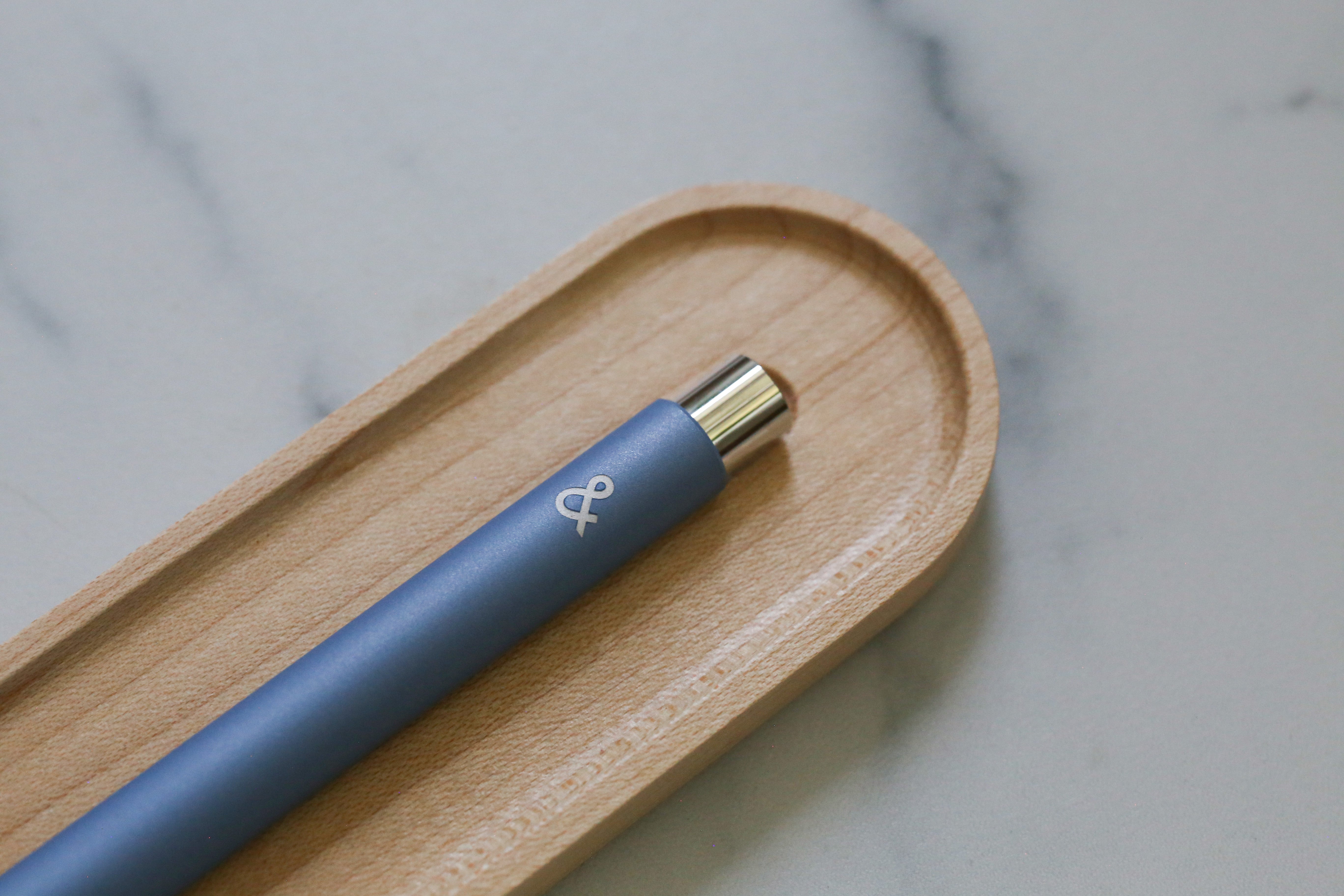 A mark one with an ampersand engraving on a pen tray.
